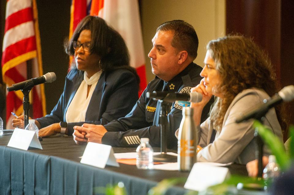 A panel consisting of Director of Community Safety LaKenya Middlebrook, Knoxville Police Chief Paul Noel, Knoxville Mayor Indya Kincannon and crime researcher Thomas Abt (offscreen) listens to an attendee's question at the Analyzing and Addressing Gun Violence in Knoxville seminar at the Howard H. Baker Jr. Center for Public Policy in Knoxville on Nov. 2.