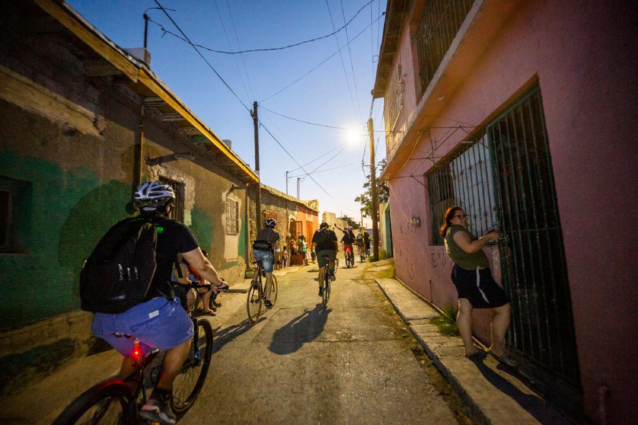 Bastards Border Cycling Club cylists ridiing through the streets of Downtown Juarez on a warm night in May 2022. 