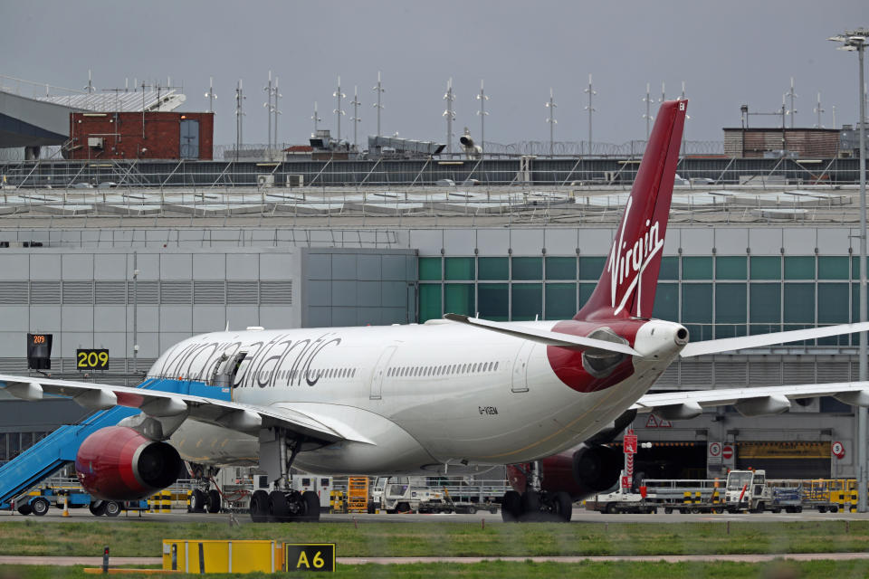 A Virgin Atlantic plane taxiing at Heathrow Airport. The airline has admitted flying planes that are "almost empty" in order to keep take-off and landing slots despite demand plummeting due to the coronavirus.