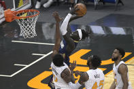 New Orleans Pelicans forward Wenyen Gabriel goes up for a shot in front of Orlando Magic forward Robert Franks (0), forward Donta Hall (45) and guard Chasson Randle, right, during the second half of an NBA basketball game Thursday, April 22, 2021, in Orlando, Fla. (AP Photo/Phelan M. Ebenhack)