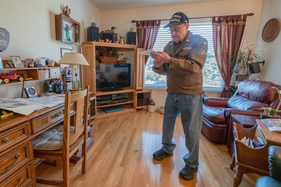 World War II veteran Bruce Elson reads a letter from the daughter of his former pen pal who was a Japanese soldier.