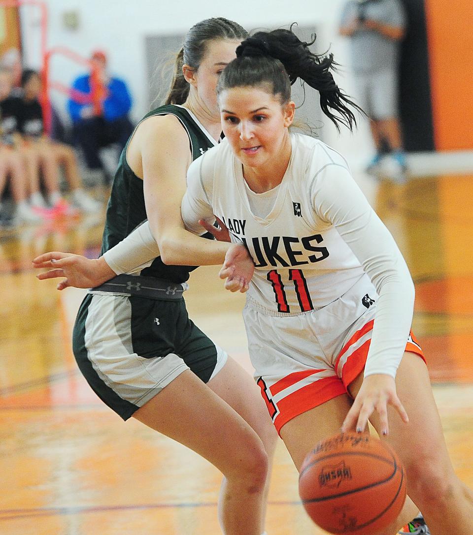 Marlington's Chelsea Evanich drives to the basket against Central Catholic, Saturday Feb. 17, 2024.