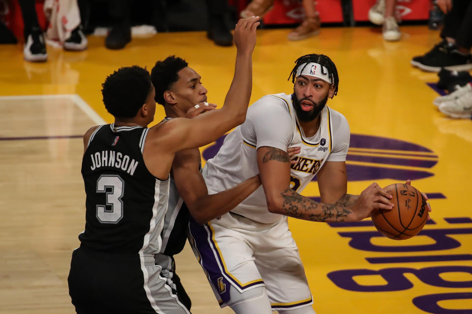 Pictured here, Lakers forward Anthony Davis being double-teamed by Spurs duo Keldon Johnson and Devin Vassell.