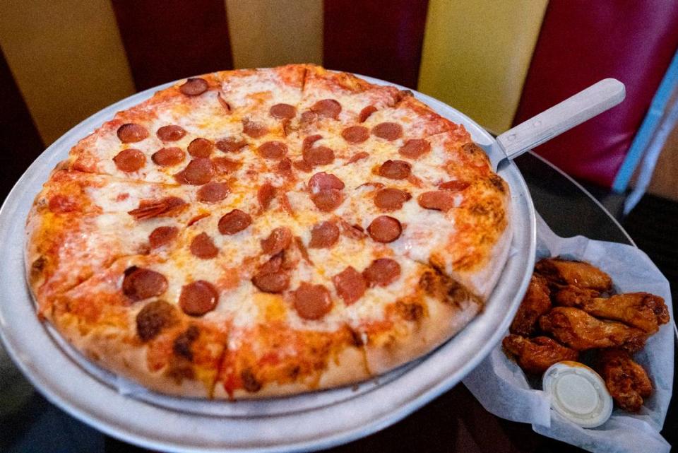 A pepperoni pizza and wings with Tim’s sauce at the Hofrbau in Bellefonte.