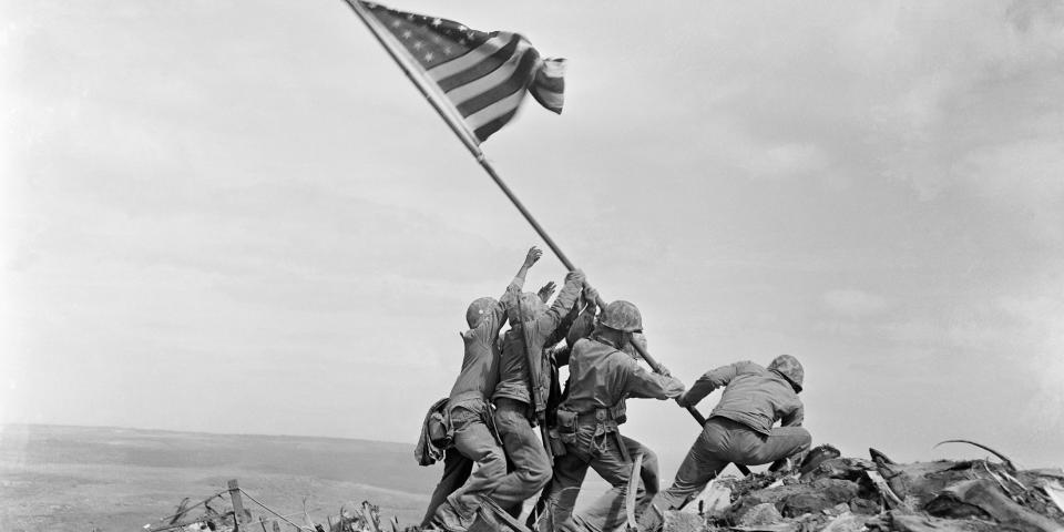 In this February 23, 1945 file photo, US Marines of the 28th Regiment, 5th Division, raise the American flag atop Mt. Suribachi, Iwo Jima, Japan. AP Photo/Joe Rosenthal