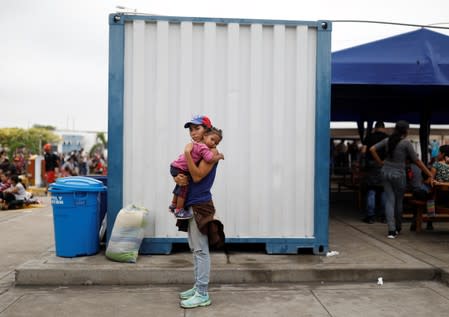 The Wider Image: Venezuelan mothers, children in tow, rush to migrate