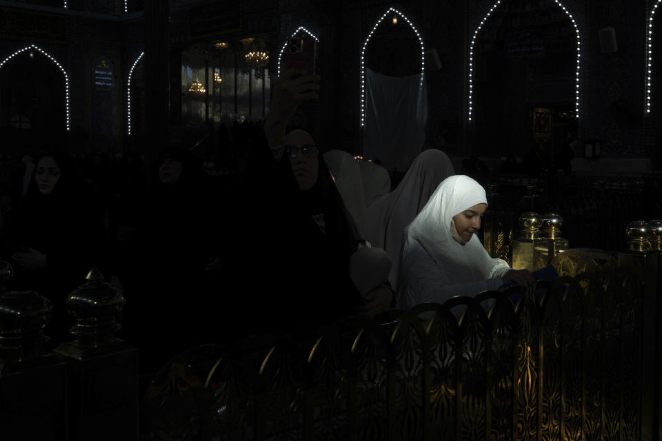 Shiite Muslim worshippers gather at the holy shrine of Imam Hussein in Karbala, Iraq, Friday, Jan, 12, 2024. (AP Photo/Hadi Mizban)