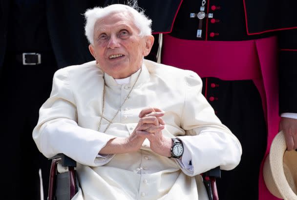 FILE PHOTO: Pope Emeritus Benedict XVI gestures at the Munich Airport before his departure to Rome, June 22, 2020. Former Pope Benedict traveled to his native Germany in 2020 to visit his ailing older brother. (Sven Hoppe/Pool via Reuters)