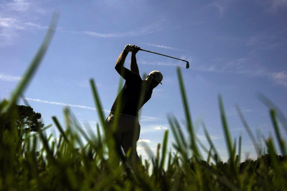 Jon Rahm of Spain, hits from the third tee during the third round of the Tour Championship golf tournament Saturday, Sept. 4, 2021, at East Lake Golf Club in Atlanta. (AP Photo/Brynn Anderson)