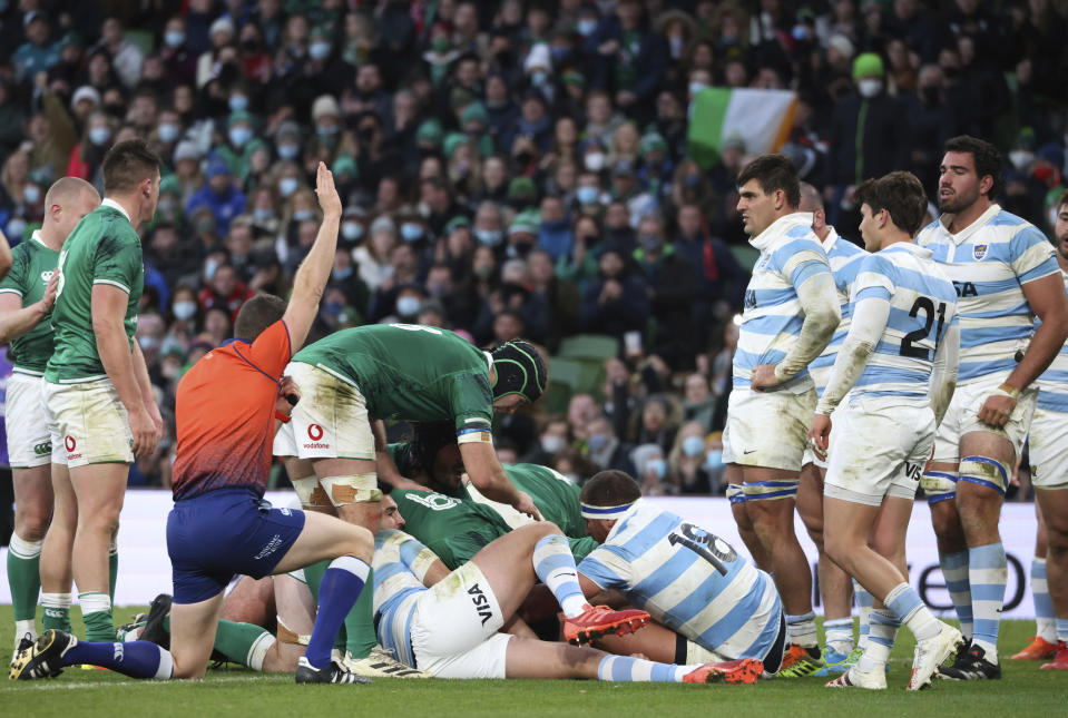 Referee Matthew Carley of England, signals a try scored by Ireland's Dan Sheehan during the rugby union international match between Ireland and Argentina at the Aviva Stadium in Dublin, Ireland, Sunday, Nov. 21, 2021. (AP Photo/Peter Morrison)