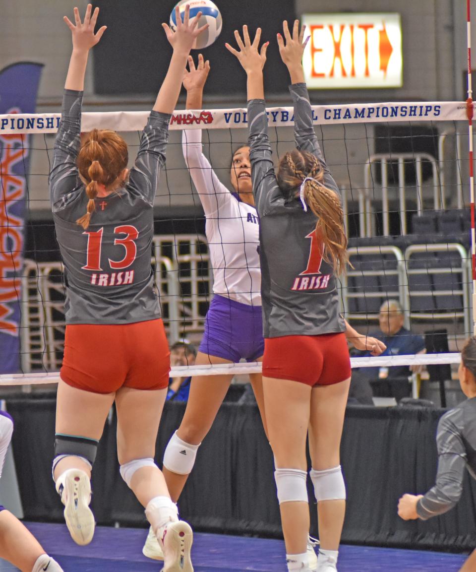 Athens senior Jocelyn Hall looks for a tip versus Sacred Heart on Saturday