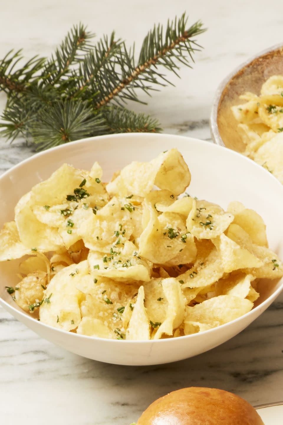 <p>Here's a last-minute app idea: Upgrade store-bought chips with a sprinkle of Parmesan and fresh chives.</p><p><em><a href="https://www.goodhousekeeping.com/food-recipes/easy/a25310835/parmesan-chive-chips-recipe/" rel="nofollow noopener" target="_blank" data-ylk="slk:Get the recipe for Parmesan-Chive Chips »;elm:context_link;itc:0;sec:content-canvas" class="link ">Get the recipe for Parmesan-Chive Chips »</a></em></p>