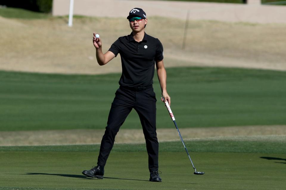 Min Woo Lee gestures to the crowd after a birdie on the 15th green of the Nicklaus Tournament Course at PGA West during the first round of The American Express in La Quinta, Calif., on Thursday, Jan. 18, 2024.