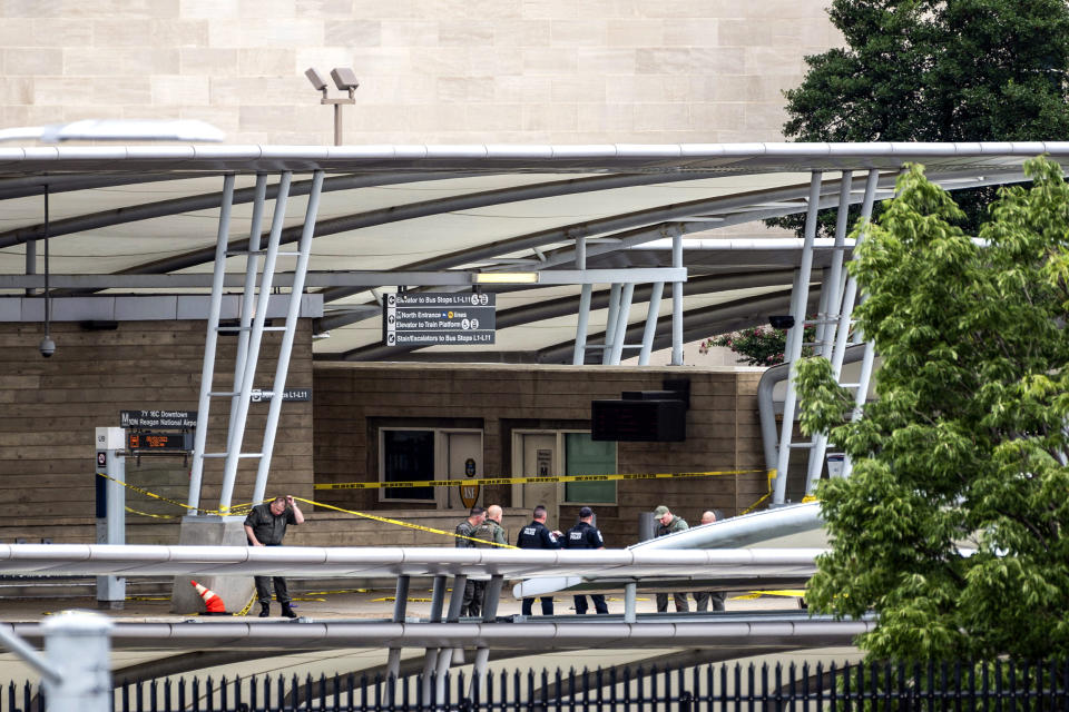 Image: A police officer passes underneath barrier tape outside the Pentagon Metro area on Aug. 3, 2021, at the Pentagon in Washington. (Kevin Wolf / AP)