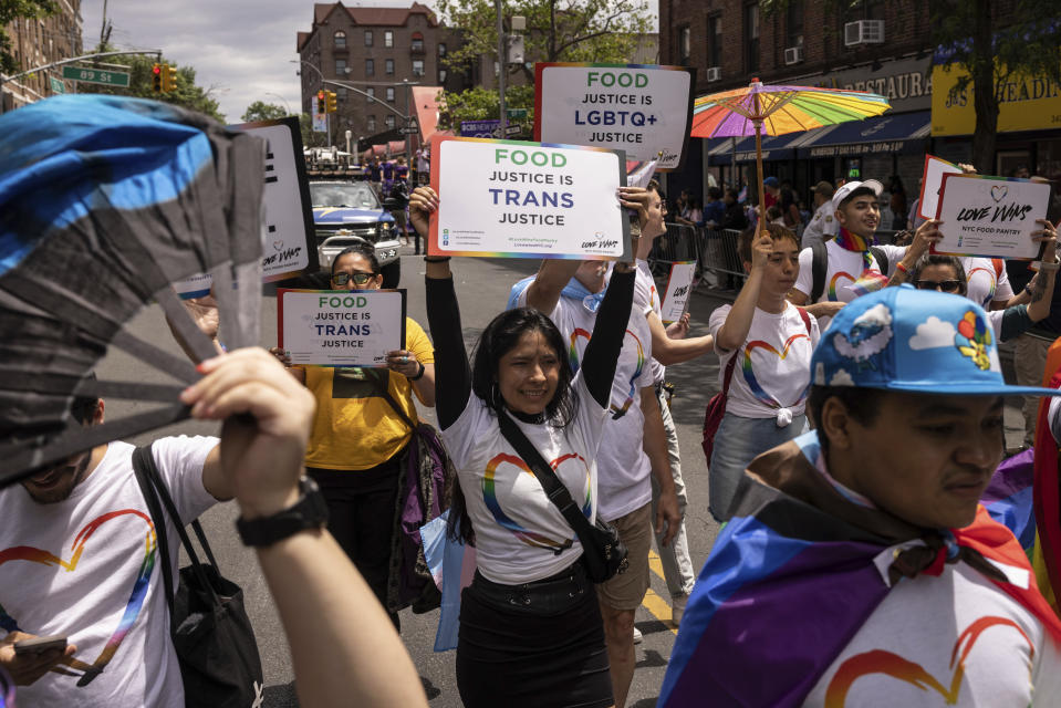 Participants march during the 31st annual Queens Pride Parade and Multicultural Festival, Sunday, June. 4, 2023, in New York. The growing number of new laws and policies, including restrictions on gender-affirming care, public bathroom use and participation in sports, have prompted Pride organizers to more fully embrace a segment of the LGBTQ+ populace that hasn't always felt included in the celebration. (AP Photo/Yuki Iwamura)