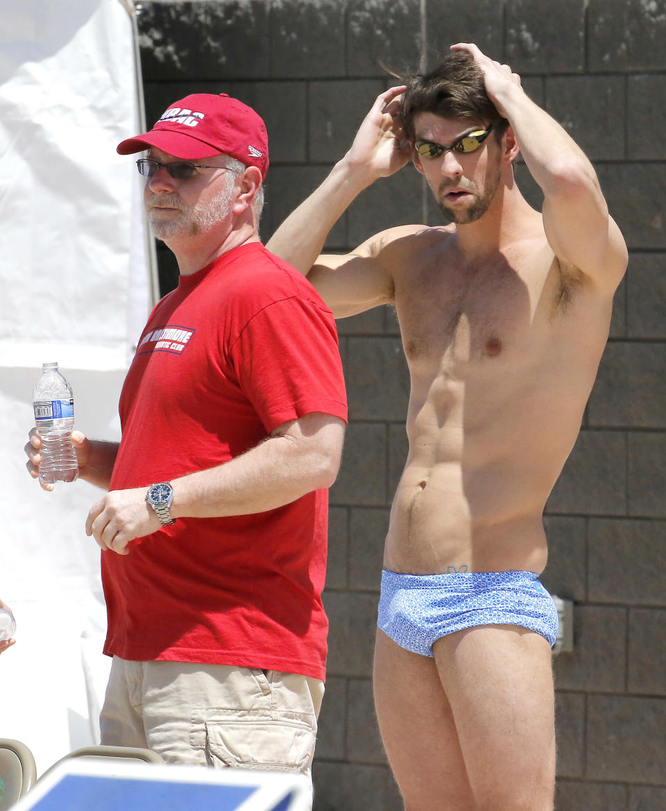 Michael Phelps prepares to practice, Wednesday, April 23, 2014, in Mesa, Ariz. Phelps is competing in the Arena Grand Prix at Mesa as he returns to competitive swimming after a nearly two-year retirement. (AP Photo/Matt York)