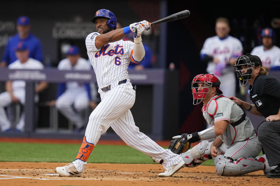 New York Mets' Starling Marte (6) hits an RBI double against the Philadelphia Phillies during the first inning of a London Series baseball game in London, Saturday, June 8, 2024. (AP Photo/Kirsty Wigglesworth)