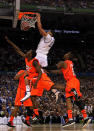 NEW ORLEANS, LA - MARCH 31: Anthony Davis #23 of the Kentucky Wildcats dunks over Russ Smith #2 of the Louisville Cardinals during the National Semifinal game of the 2012 NCAA Division I Men's Basketball Championship at the Mercedes-Benz Superdome on March 31, 2012 in New Orleans, Louisiana. (Photo by Chris Graythen/Getty Images)