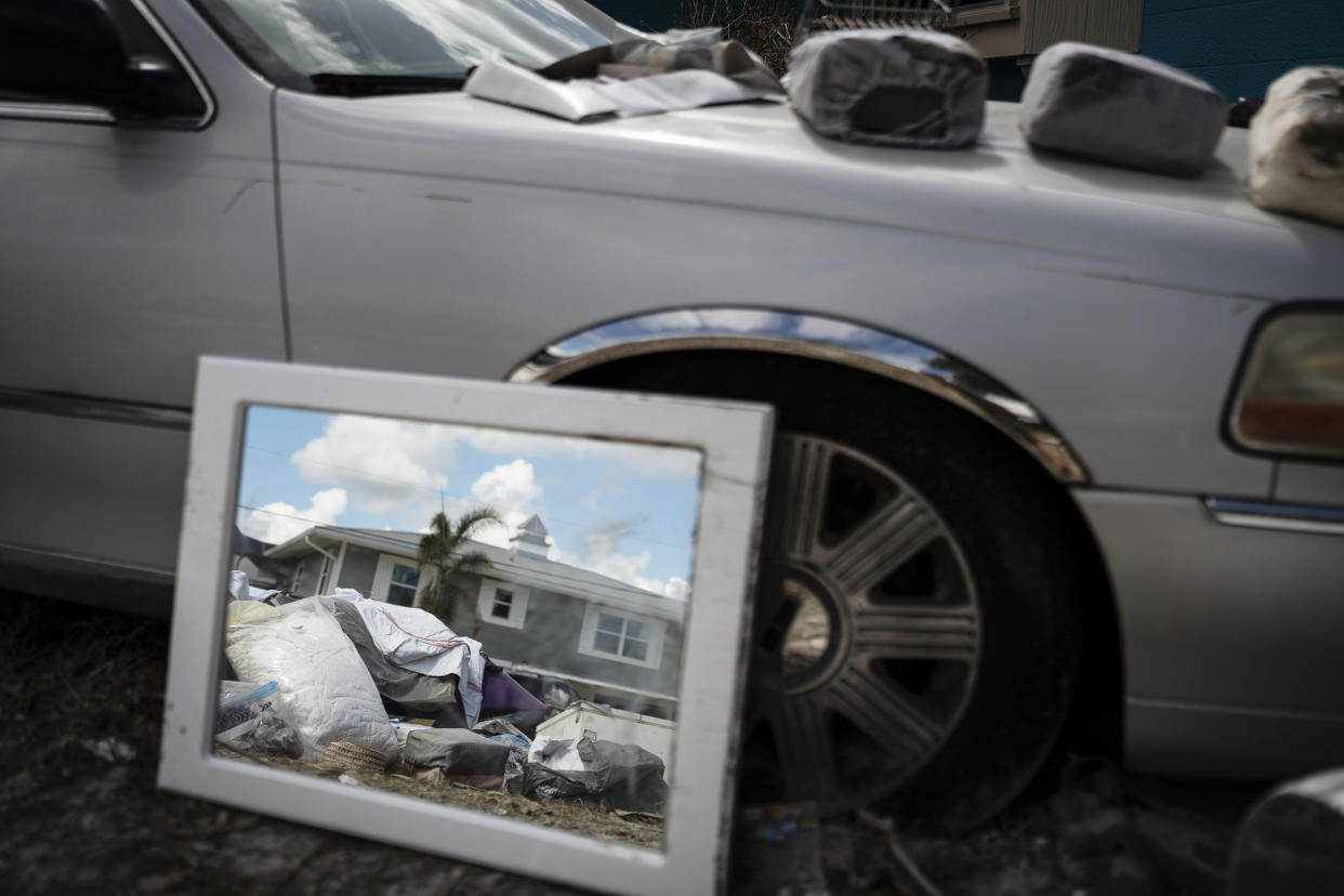 Debris in front of a home in Myers Beach, Fla. (Thomas Simonetti for NBC News)