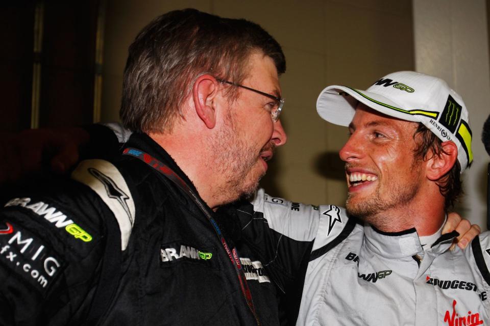 ross brawn and jenson button celebrate winning the title in 2009