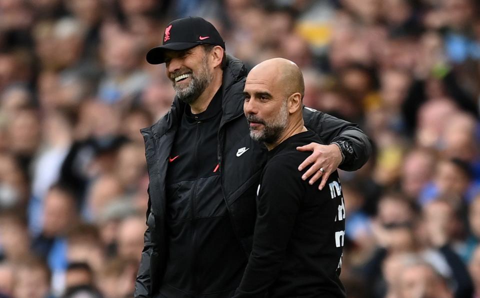 Pep Guardiola, Manager of Manchester City interacts with Jurgen Klopp