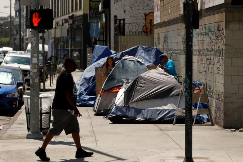 Tents and tarps erected by homeless people are shown along sidewalks and streets in the skid row area of downtown Los Angeles, California