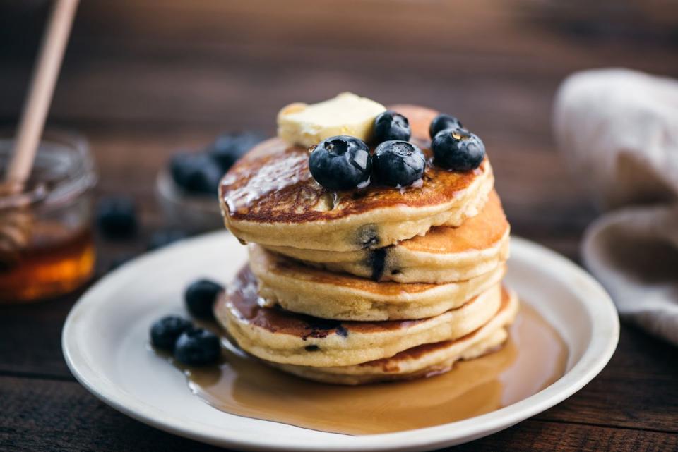 tasty blueberry pancakes with syrup