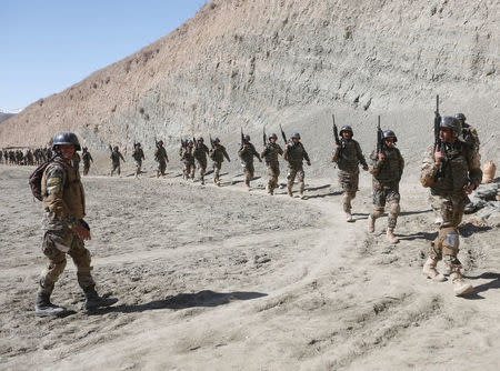 New recruits to the Afghan army Special Forces take part in a military exercise in Rishkhur district outside Kabul, Afghanistan February 25, 2017. Picture taken on February 25, 2017. REUTERS/Omar Sobhani