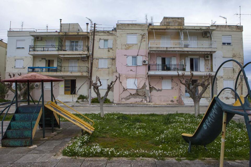 Damaged buildings are seen next to a playground after an earthquake in Lixouri on the island of Kefalonia, western Greece on Monday, Feb. 3, 2014. A strong earthquake with a preliminary magnitude between 5.7 and 6.1 hit the western Greek island of Kefalonia before dawn Monday, sending scared residents into the streets just over a week after a similar quake damaged hundreds of buildings, reviving memories of a disaster in the 1950s. (AP Photo)