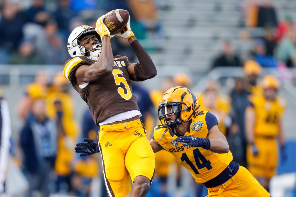 Isaiah Neyor, making a 42-yard touchdown catch in Wyoming's 52-38 win over Kent State in the Famous Idaho Potato Bowl last month, had 44 receptions for 878 yards and 12 touchdowns in 2021.