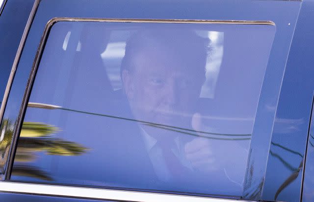 <p>Joe Raedle/Getty</p> Donald Trump leaves a Florida courthouse after a hearing related to his criminal classified documents case on March 14, 2024