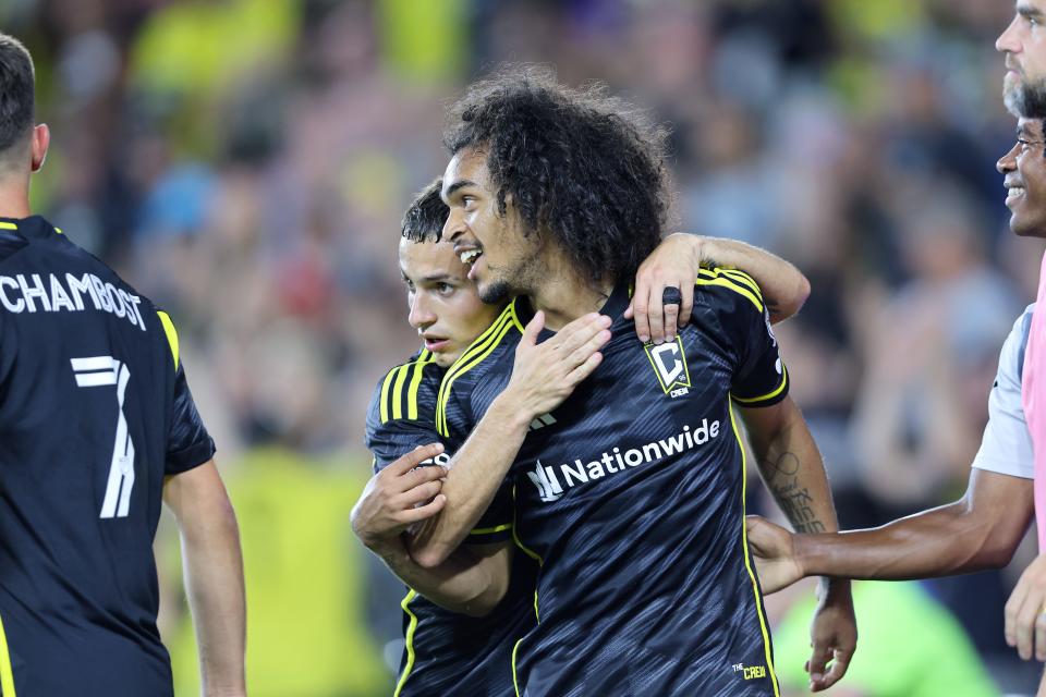 Sep 21, 2024; Columbus, Ohio, USA; Columbus Crew midfielder Aziel Jackson (13) celebrates his goal with Columbus Crew midfielder Alexandru Matan (back) during the second half against the Orlando City at Lower.com Field. Mandatory Credit: Joseph Maiorana-Imagn Images