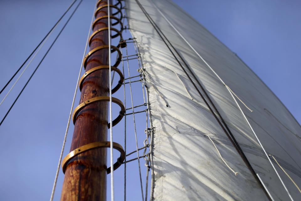 In this Dec. 20, 2013 picture, wooden hoops hold the mainsail to the mast aboard the skipjack Hilda M. Willing in Tangier Sound near Deal Island, Md. (AP Photo/Patrick Semansky)