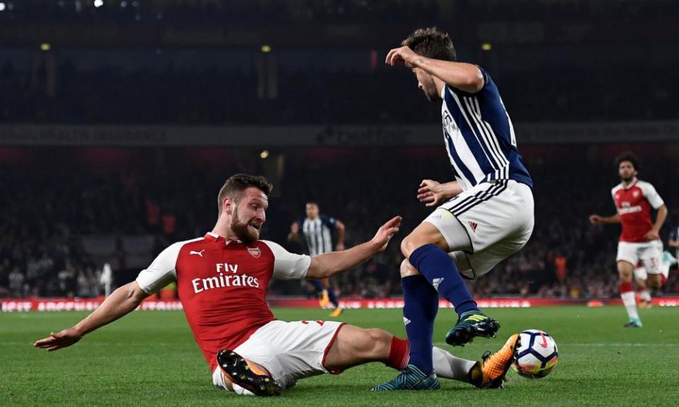 West Bromwich Albion’s Jay Rodriguez goes down under a challenge from Arsenal’s Shkodran Mustafi leading to appeals for a penalty.