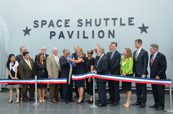 As astronauts and officials looked on, NASA Administrator Charles Bolden and Intrepid Sea, Air and Space Museum president Susan Marenoff-Zausner took part in a ribbon cutting ceremony for the New York City museum’s new exhibit of space shuttle