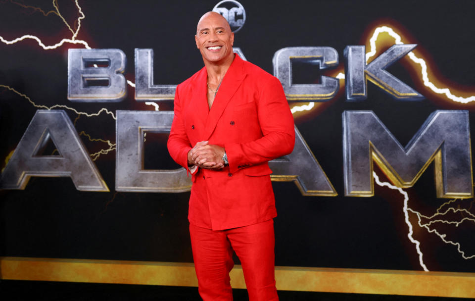 Actor Dwayne Johnson poses for photographers as he arrives for the world premiere of the film 'Black Adam' in Times Square in New York City, New York, U.S., October 12, 2022.  REUTERS/Mike Segar