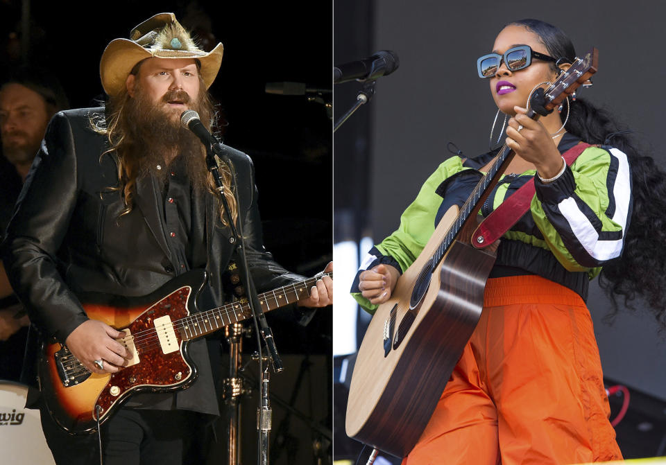 Chris Stapleton performs at the 50th annual CMA Awards on Nov. 2, 2016, in Nashville, Tenn., left, and H.E.R. performs at Lollapalooza on Aug. 1, 2019, in Chicago. Stapleton and fellow guitar slayer H.E.R. are joining forces onstage at Wednesday's CMT Music Awards show celebrating the year's best country music videos. The event will air at 8 p.m. Eastern. (AP Photo)