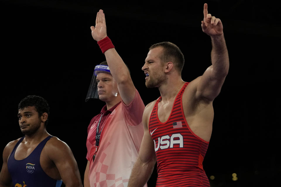United States' David Morris Taylor III, right, celebrates defeating India's Deepak Punia compete in the men's 86kg Freestyle semifinal wrestling match at the 2020 Summer Olympics, Wednesday, Aug. 4, 2021, in Chiba, Japan. (AP Photo/Aaron Favila)