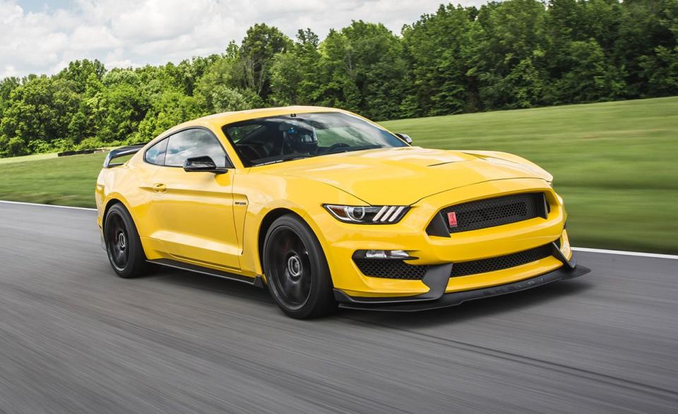<p>Singing an unmistakable wail thanks to its flat-plane-crank 5.2-liter V-8, the current Mustang Shelby GT350 is a serious, 520-hp driver's machine. It may not be the quickest in a straight line or the easiest to drive every day, but it has personality for days, especially in its <a rel="nofollow noopener" href="https://www.caranddriver.com/reviews/2017-ford-mustang-shelby-gt350-reliability-update-3" target="_blank" data-ylk="slk:immensely capable GT350R guise;elm:context_link;itc:0;sec:content-canvas" class="link ">immensely capable GT350R guise</a>. Largely thanks to the added grip of the R's wider, stickier Michelin Pilot Sport Cup 2 rubber, the track-focused model proved the fleetest example we've tested, sprinting to 60 mph in 3.9 seconds and through the quarter-mile in 12.2 at 119 mph-0.3 and 0.2 second (and 1 mph) quicker than our long-term, non-R 2017 GT350.<br></p>