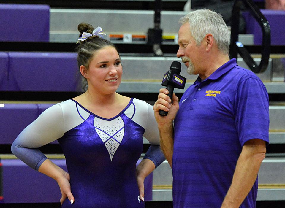 Former Watertown head gymnastics coach Mark Bellum interviews Arrow senior Kaitlynn Rudebusch for Arrow TV during a high school gymnastics triangular on Thursday, Jan. 25, 2024 in the Watertown Civic Arena.