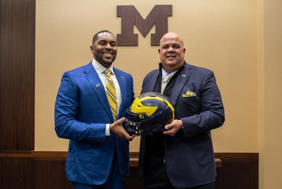 Sherrone Moore, head coach of the University of Michigan, stands next to Warde Manuel, Michigan’s Director of Athletics, during a press conference inside the Junge Family Champions Center in Ann Arbor on Saturday, Jan. 27, 2024.