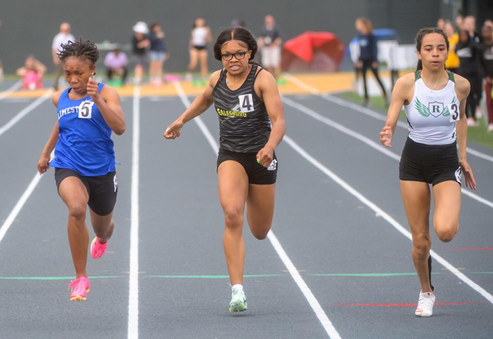 Limestone's Ranaisha Howard-Dunigan, left, edges Richwoods' Lena Jackson, right, and Galesburg's Syriah Boyd to win the 100-meter dash Thursday, May 11, 2023 at the Galesburg Sectiona Track and Field Meet in Galesburg. Lena Jackson finished second and Boyd was third.