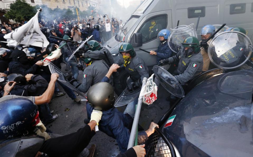 Protesters clash with Guardia di Finanza during a protest in front of the Ministry of Finance building in downtown Rome