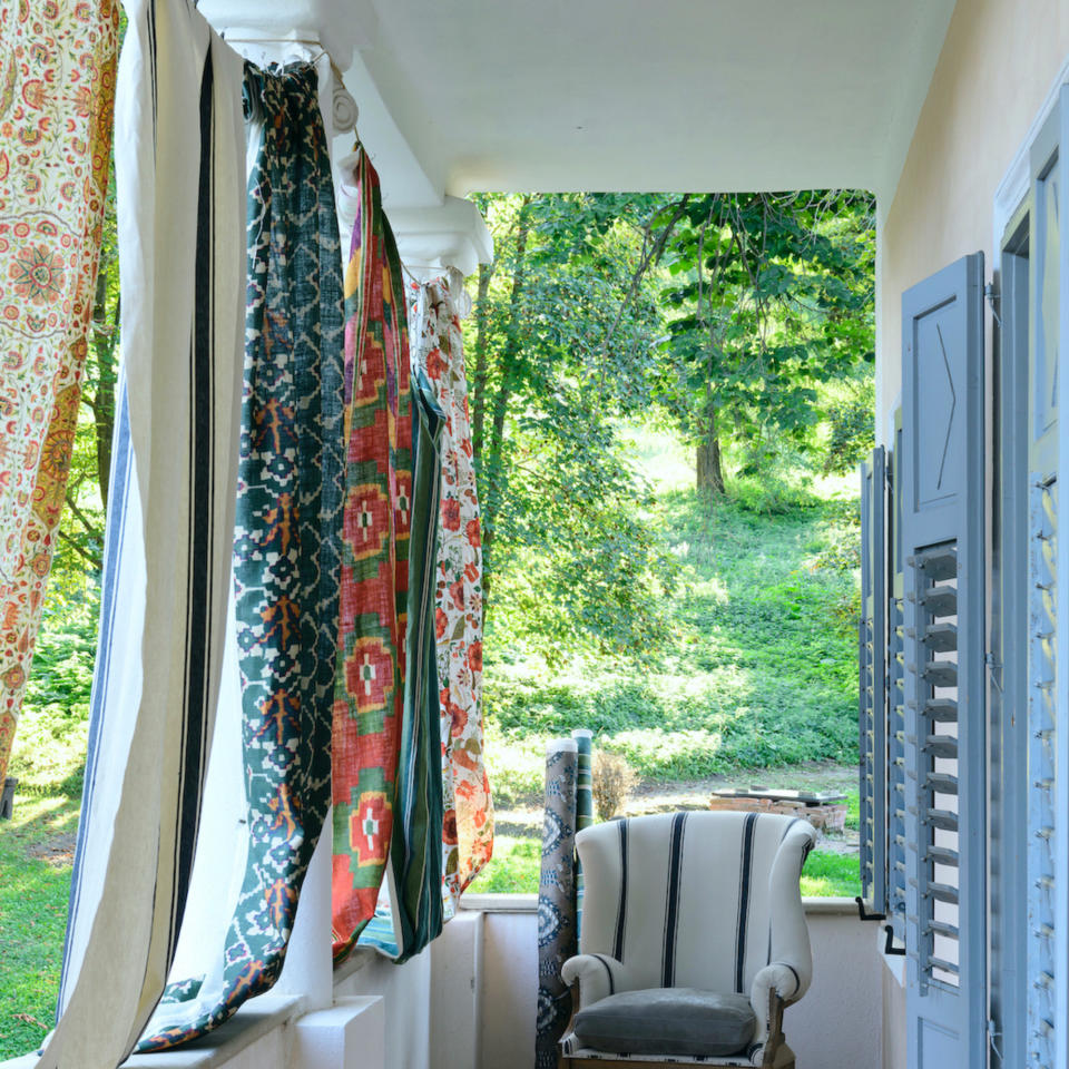 Hang fabric over a balcony