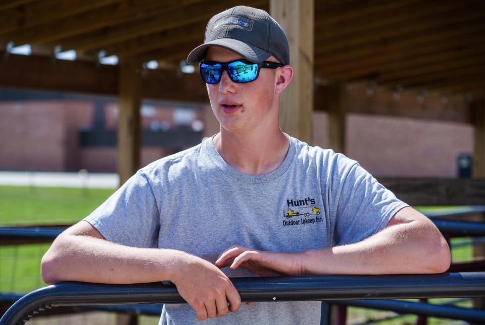 Lane Hunt, a freshman student at Maconaquah High School, is one of the leaders of the school's Maconaquah Cattle Company. On Tuesday, May 31, 2022, the first day of summer break, Hunt got to the barn early to clean the cow manure from the stalls. 