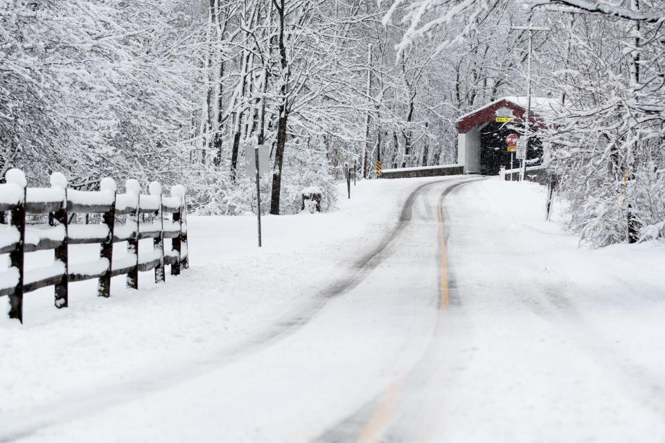 Snow blankets Old Iron Hill Road at Pine Valley Covered Bridge, in New Britain Township, during a snow storm Tuesday, February, 13, 2024.