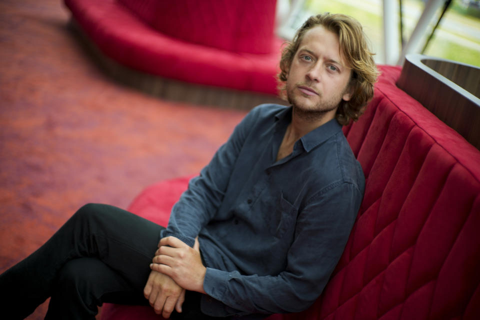 Tobias Nierop, who plays soccer legend Johan Cruyff, poses for a portrait during a presentation of "14 The Musical" in Leusden, Netherlands, Friday, June 11, 2021. On the opening day of the pandemic-delayed European 2020 Soccer Championship, the cast and crew of "14 The Musical", referring to Cruyff's shirt number, raised the curtain on the new musical eulogizing the country's most famous footballing son, Johan Cruyff. (AP Photo/Peter Dejong)