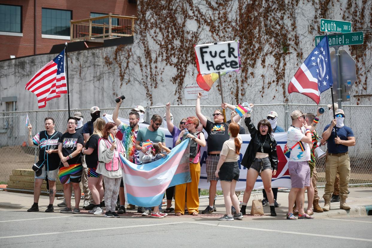 Patriot Front protesters stand at the corner of McDaniel Street and South Avenue during Ozarks Pridefest on Saturday, June 10, 2023. Counter protesters blocked the organization's signs and yelled over them when members tried to speak.