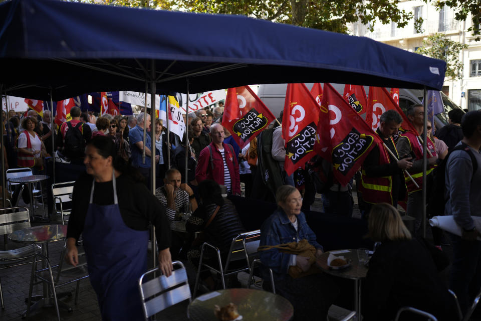 Protesters gather ahead of a demonstration, Tuesday, Oct. 18, 2022 in Marseille, southern France. France is in the grip of transport strikes and protests for salary raise on Tuesday that threaten to dovetail with days of wage strikes that have already hobbled fuel refineries and depots, sparking chronic gasoline shortages around the country. (AP Photo/Daniel Cole)