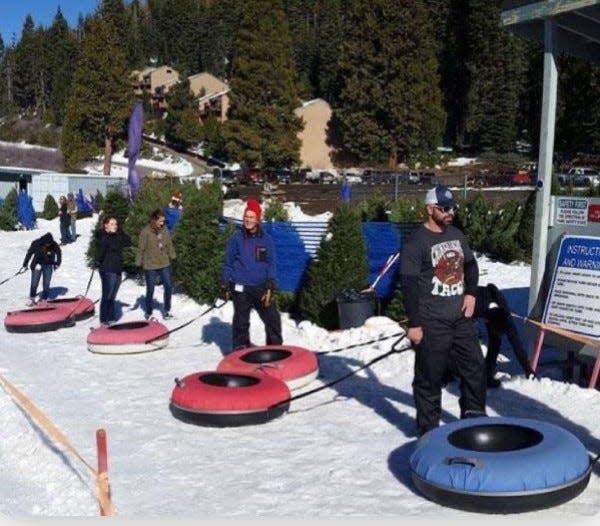 Tubers gather at top of Leland Snowplay runs.